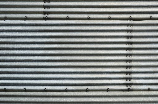 An abstract image of a corrugated steel building.
