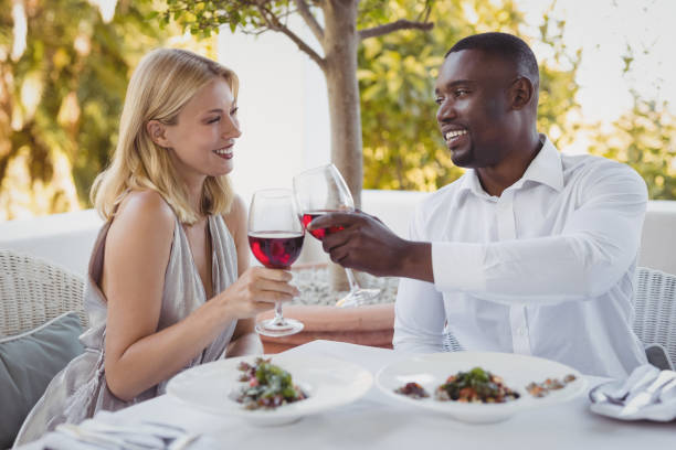 istock Romantic couple toasting their wine glasses 803574722