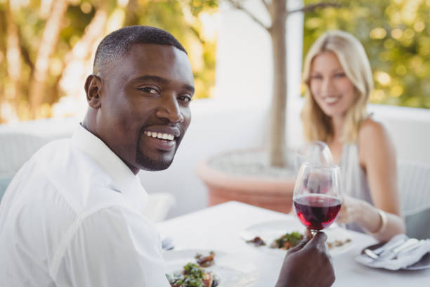 istock Couple toasting their wine glasses 803574738