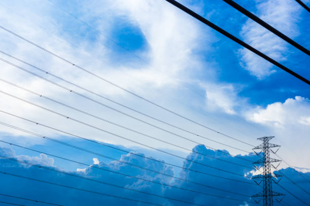 electric pole with blue sky and clouds