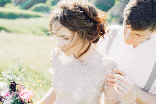 istock wedding couple on  nature.  bride and groom hugging at  wedding. 803577444