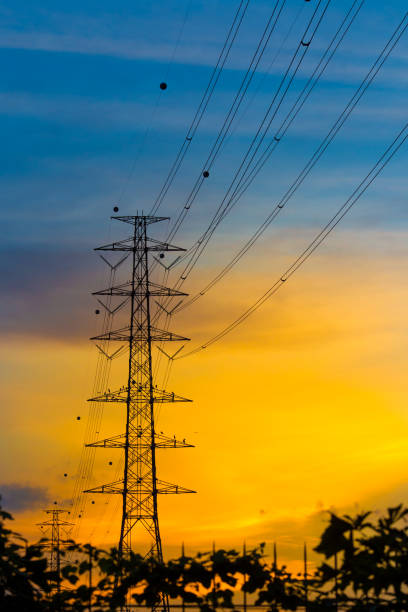 istock High voltage towers at sunset 803591338