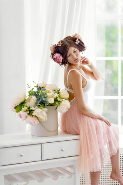 istock beautiful woman with white flowers on the head 803600268
