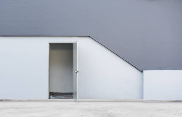 istock Door opened with white and grey wall of modern building 803605544