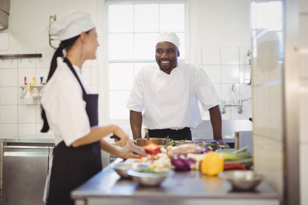 istock Chefs chopping vegetables in the commercial kitchen 803609340