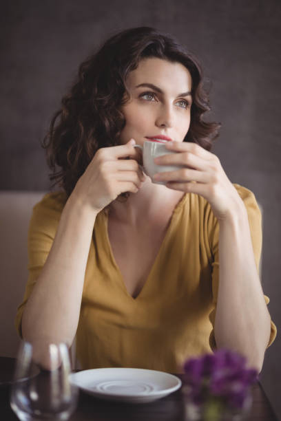 istock Woman having coffee in restaurant 803609606