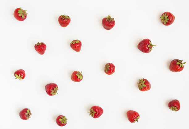 istock Fresh strawberries scattered on a white background. Concept of h 803613650