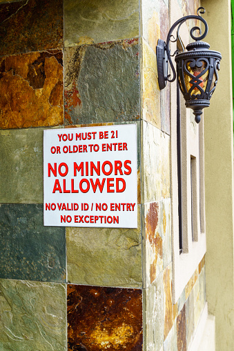 No minors allowed sign on ornamental wall cladding in Texas