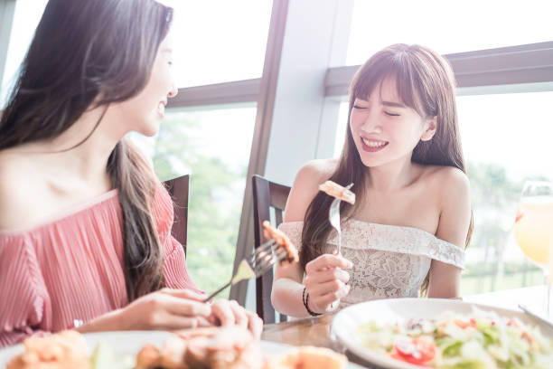 istock women dine in restaurant 803614130