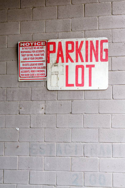 Parking lot sign in both english and spanish language in Texas