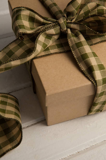 istock Close up of tied gift box on table 803623796