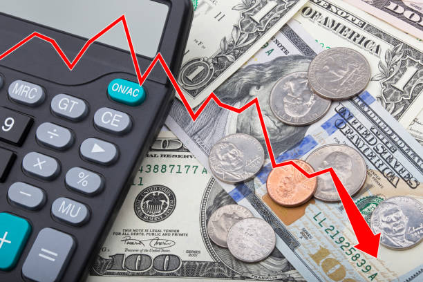 istock Graph showing USD bank notes with coins and a calculator 803625156