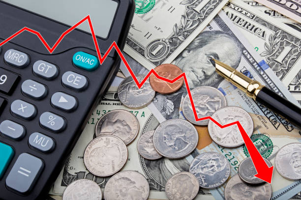 istock Graph showing USD bank notes with coins and a calculator 803625280