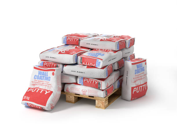 istock Putty bags stack on wooden pallet. Paper sacks isolated on white background. 3d illustration 803636492