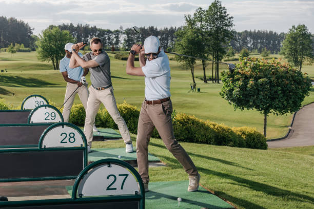 istock group of golf players playing golf together at golf course 803643128