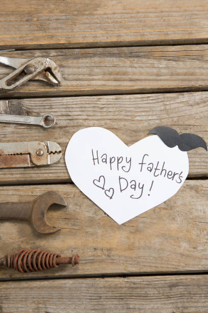 istock Close up of fathers day text by work tools 803643902