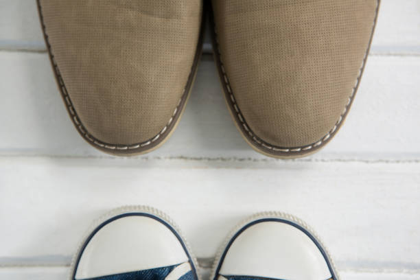 istock Cropped image of shoes on floor 803651322
