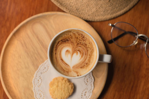 istock Coffee cappuccino on wood table. 803654400