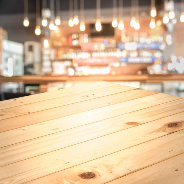 istock Empty wood top table with space for display product in Blurred cafe background. 803658266