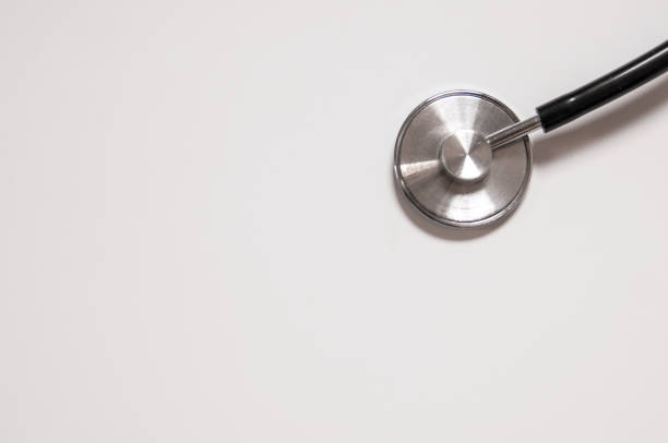 istock Close up view of black stethoscope on white back 803667064