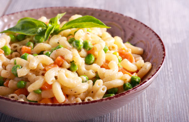 istock Creamy pea and carrot pasta 803670334