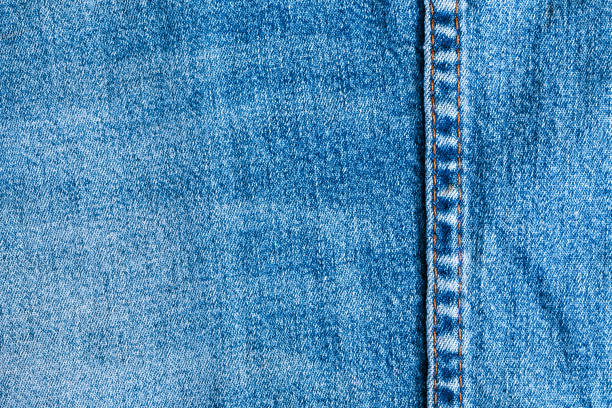 istock Texture and seam of denim fabric 803671102