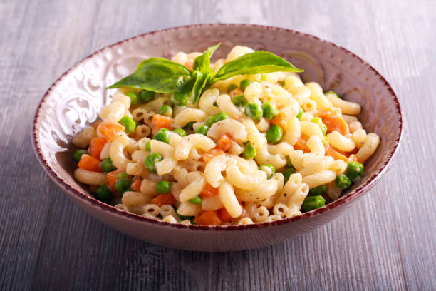 istock Creamy pea and carrot pasta 803674380
