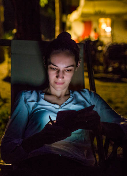istock Woman with smart phone at nigh 803677432