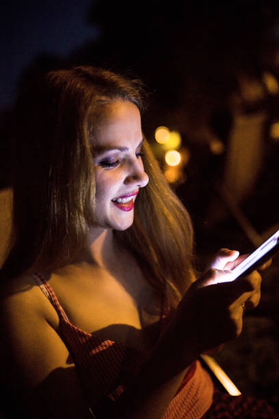 istock Woman with smart phone at nigh 803686436