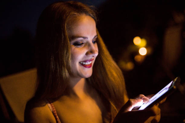 istock Woman with smart phone at nigh 803686596