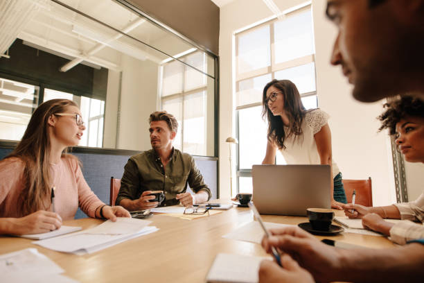 istock Business team discussing new strategy in meeting 803690130