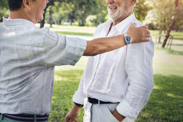 istock Senior Friends Retirement Talking Laughing Concept 803708858