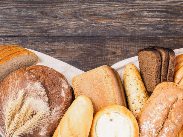 istock bread assortment on brown wooden background 803708870