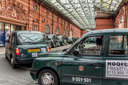 Nottingham,England - September 29, 2010: Taxis waiting for fares at the Nottingham Railway Station before renovation in 2013