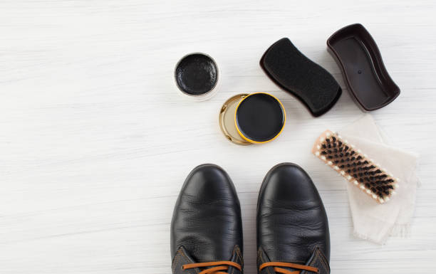 istock Black shoes and cream with brush care 803716854