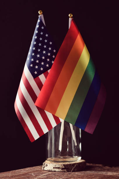 american and rainbow flags in a glass jar