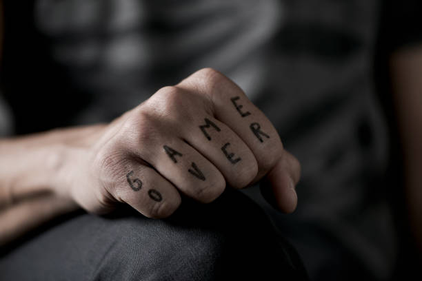 istock text game over in the knuckles of a young man 803717872