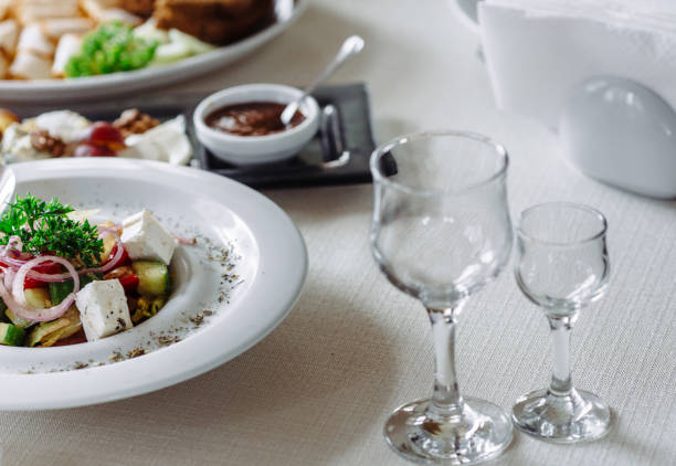 Photo of served festive table with dishes and glasses