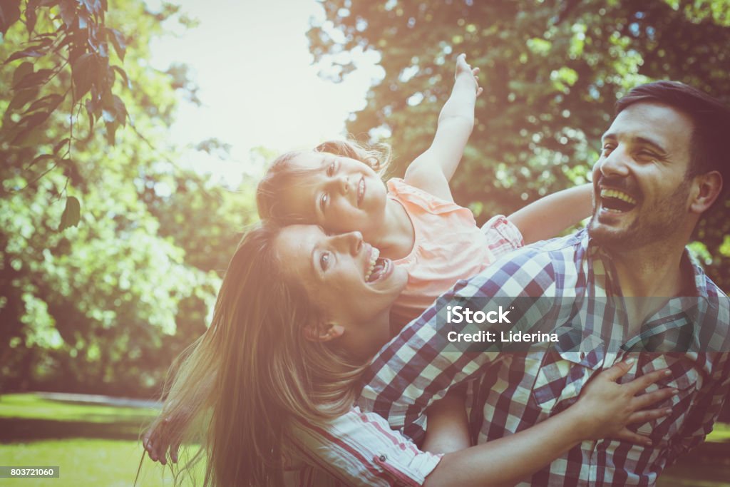 Happy family enjoying together in summer day. Family in nature. Embracing Stock Photo