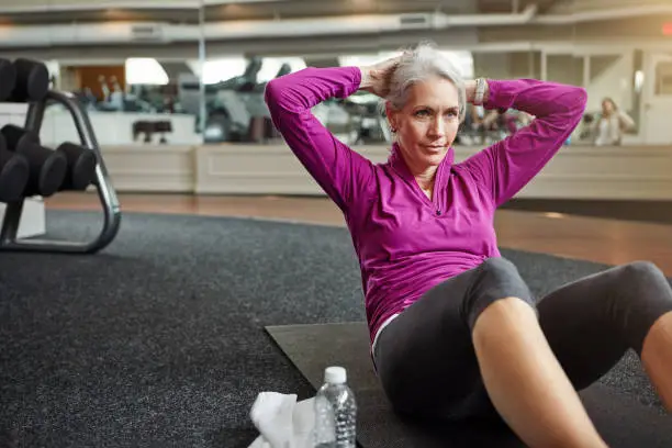 Shot of a mature woman working out at the gym