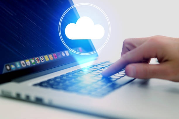 istock Concept of cloud storage icon flying out a computer - technology concept 803739906