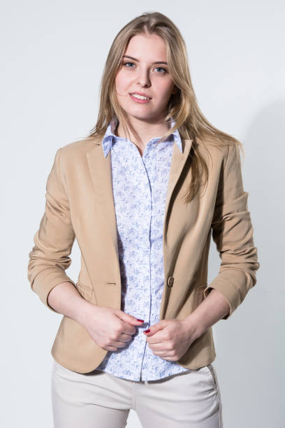 istock Beautiful young blonde in a light beige jacket 803748274