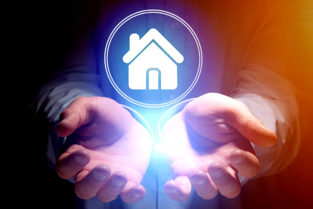 istock Businessman hand holding home icon - technology concept 803748574