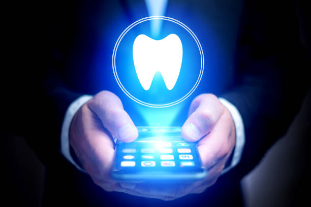 istock Concept of making an appointement with a dentist on internet - technology concept 803749316