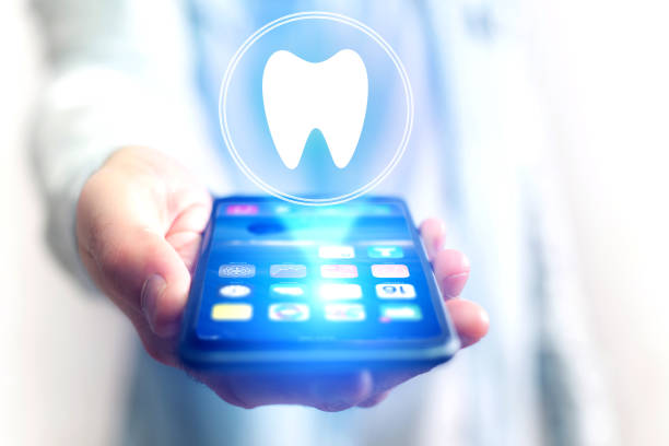 istock Concept of making an appointement with a dentist on internet - technology concept 803749350