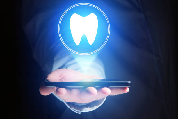 istock Concept of making an appointement with a dentist on internet - technology concept 803749366