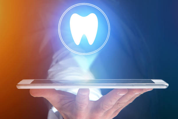 istock Concept of making an appointement with a dentist on internet - technology concept 803749368