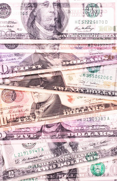 istock Abstract dollar bills of different denominations background. 803757948