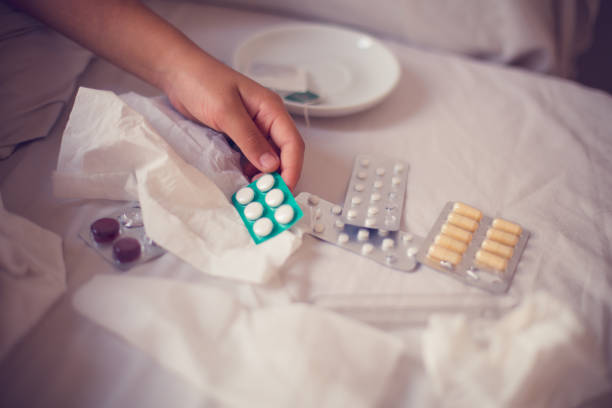 istock Pill in little girl hand 803763520