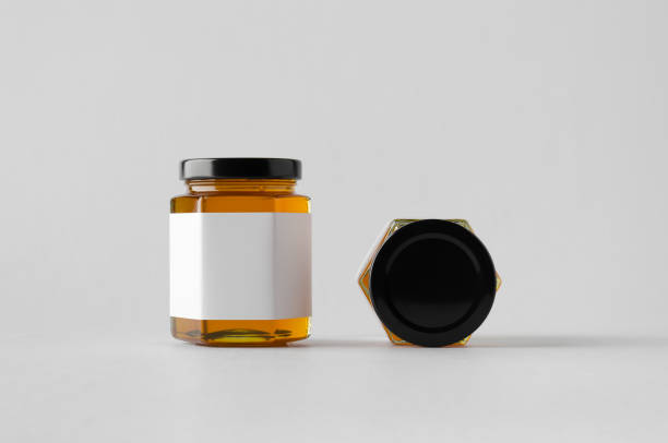istock Honey Jar Mock-Up - Two Jars. Blank Label 803792562